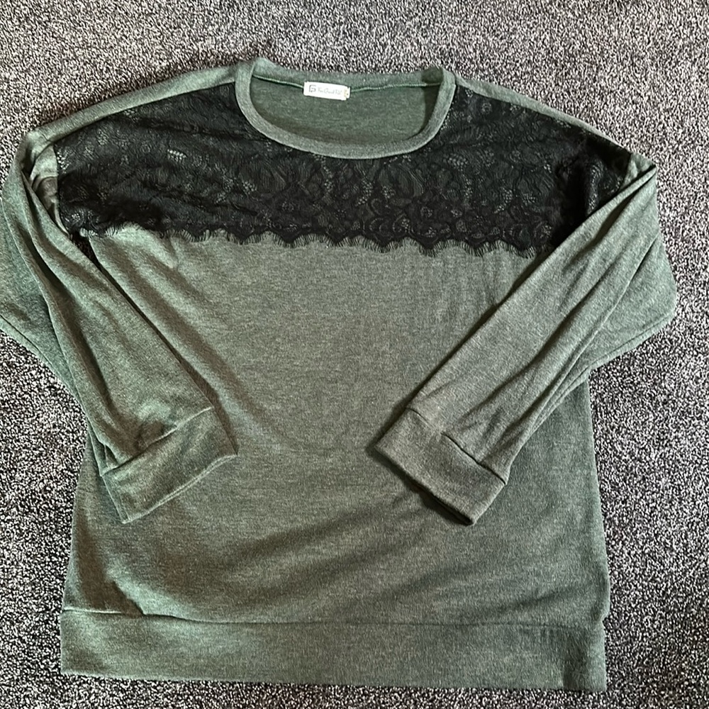 Women's green long sleeved shirt with front lace detail